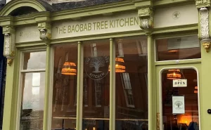 picture of shopfont painted green and white