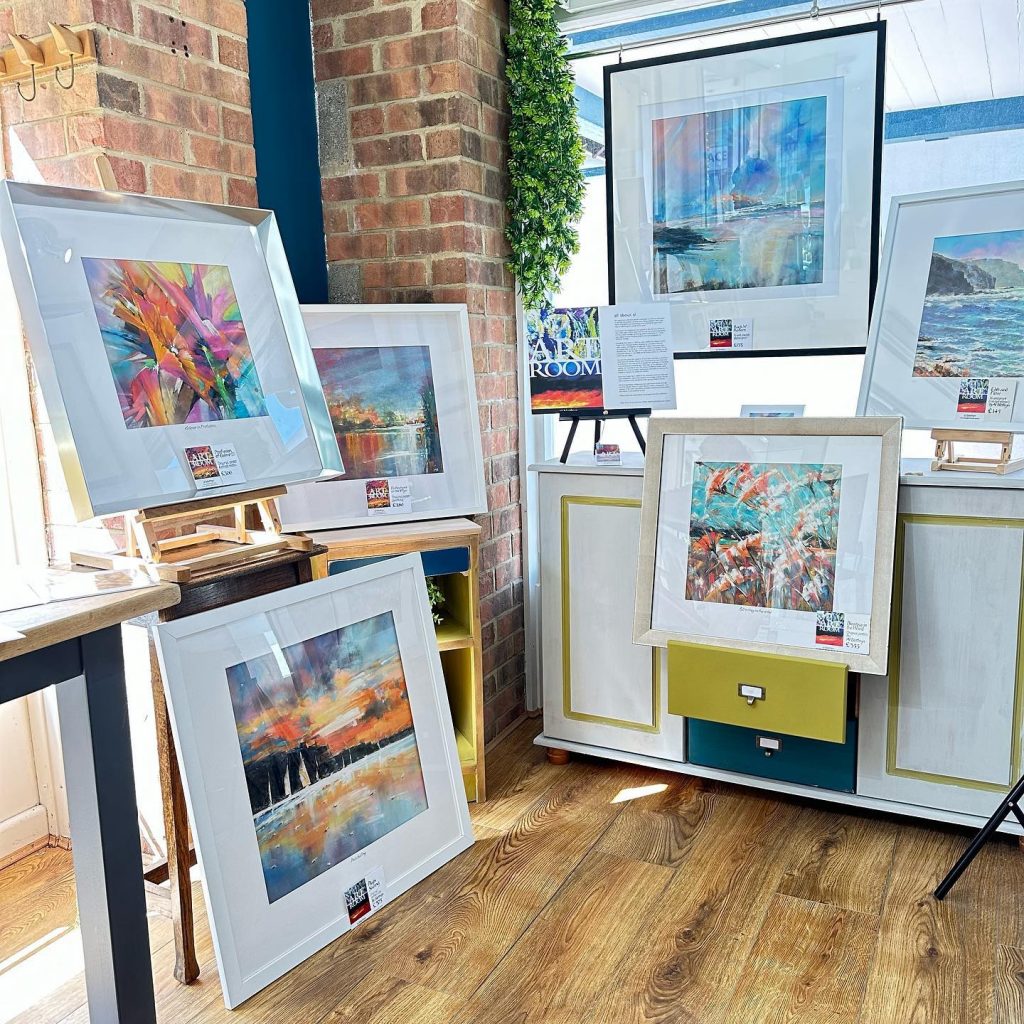 Gallery interior displaying a variety of water paintings